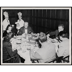 Members of Tom Pappas Chefs' Club serve diners, including Executive Director of Boys' Club of Boston Arthur T. Burger (seated, back row, second from left)