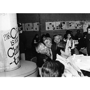 Guests attend the celebration at the Josiah Quincy School marking Chinatown's victory to build a community center on Parcel C