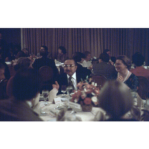 Tables of diners at a formal banquet event