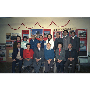 Various Chinese Progressive Association members stand and pose for a photograph with You King Yee