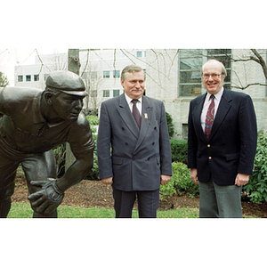 Lech Walesa and Dean Lowndes stand next to the statue of Cy Young