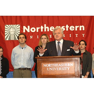 U.S. Senator Edward Kennedy (D-MA) speaks at the podium surrounded by students during a press conference on student aid