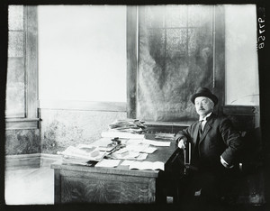Portrait of unidentified man, seated, facing front, location unknown, undated