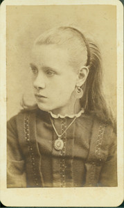 Head-and-shoulders portrait of a girl, looking left, location unknown, undated