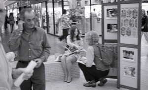 Commune member hawking the magazine in an indoor shopping mall