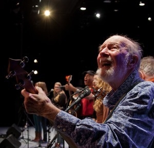 Pete Seeger on stage with his guitar at the finale of the Power of Song Award concert, Symphony Space, New York City