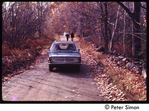 Volvo driving down a dirt road, with fall foliage, Tree Frog Farm Commune