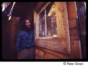 Elliot Blinder standing in a doorway, Tree Frog Farm commune