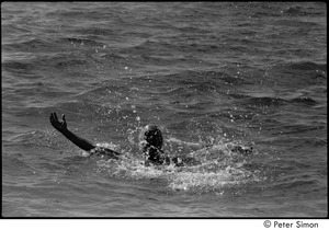 Jungle Beach: Ram Dass splashing with his arms raised