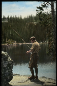 Wallowa Mountains, Oregon (woman fishing in lake)