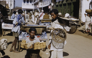 Carrying trays of sweetmeats to sell at the market in Ranchi