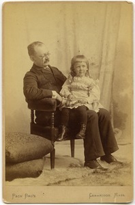 Edward Channing, seated, with daughter Alice on his lap: studio portrait