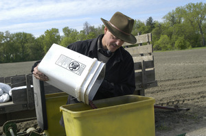 Lazy Acres Farm (Zuchowski Farm): Allan Zuchowski loading seed into a corn planter