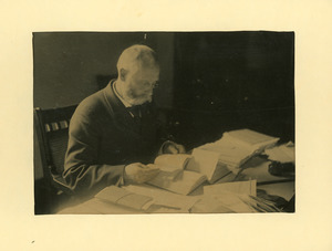 Henry Hill Goodell reading at a desk