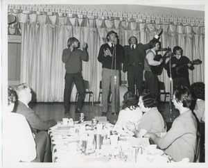 Actor Ken Howard on stage with band at Thanksgiving celebration