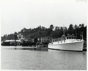 Boats by a dock, likely in Yaquina Bay