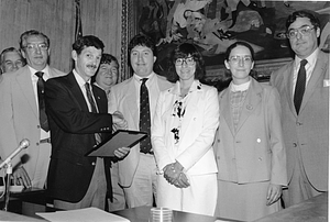 Boston City Councilor James E. Byrne with an unidentified group at a presentation at Boston City Hall
