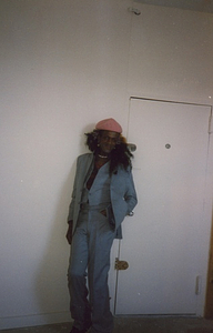 A Photograph of Marsha P. Johnson Wearing a Blue Three-Piece Suit and a Pink Hat