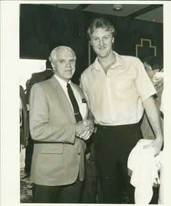 Suffolk University Public Affairs Director Louis B. Connelly with Boston Celtics player Larry Bird (right) and Joe Walsh
