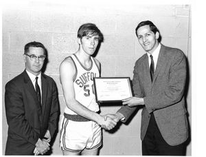Suffolk University men's basketball player receiving E.C.A.C. All-East Division III basketball team as sophomore of the week, 1968-1969