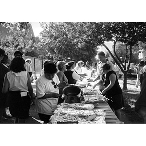 Women staffing a food table at Family Day, 1994.