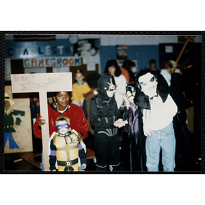 Winners of the "Best Store-Bought" Halloween costume contest pose for a group shot