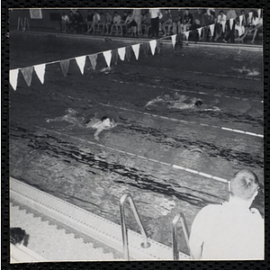 Boys compete in a swimming race