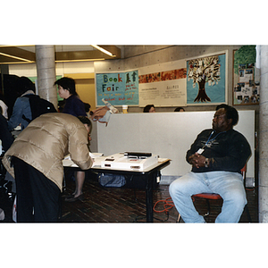 Man registering to vote at an event