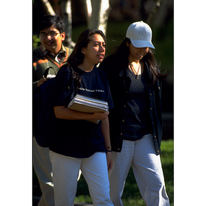 Two female students walking together on campus