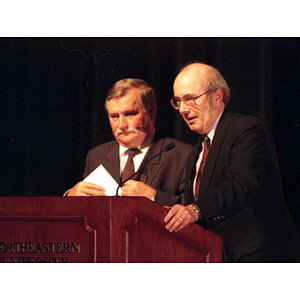 Lech Walesa and Dean Lowndes stand at the podium at the inauguration of the International Degree Program