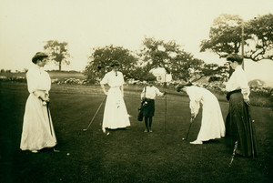 Women playing golf