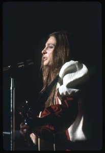 Judy Collins: with guitar, performing on stage