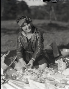 Lillian Hull: seated on a picnic blanket laid out on the grass