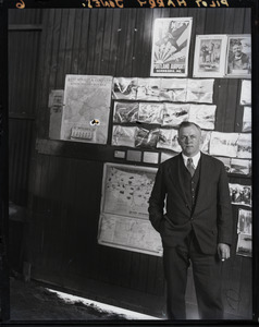 Harry Jones, pilot, in front of a sliding door