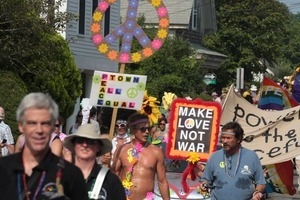 Parade marchers carrying signs for peace, including one reading 'Make love not war' : Provincetown Carnival parade