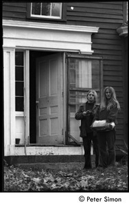 Janis Frey and Nancy Wasserman (l. to r.) standing at the front door of the Montague Farm Commune
