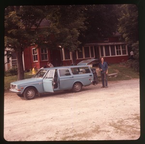 Steve Diamond with Volvo station wagon in front of Montague Farm Commune