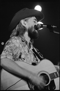 New Riders of the Purple Sage opening for the Grateful Dead at Sargent Gym, Boston University: John 'Marmaduke' Dawson playing acoustic guitar and signing