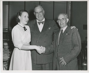 Colonel John N. Smith with retiring employee and unidentified woman