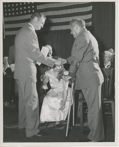 Dr. Knocke shaking hands with client at Institute Day