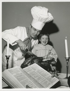 Chef and young girl posing with turkey and bible