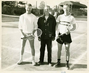 Attallah A. Kidess standing with two tennis players