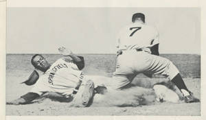 SC baseball player sliding into base