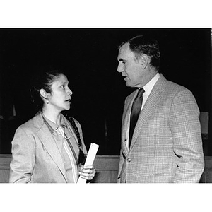 Clara Garcia and Mayor Flynn in conversation during a press conference.