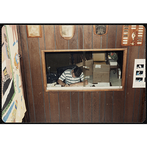 A male staff member working in his office