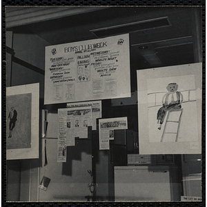 Boys' Clubs of Boston promotional materials attached to a store window, including a Boys' Club Week poster, newspaper clippings, and children's drawings