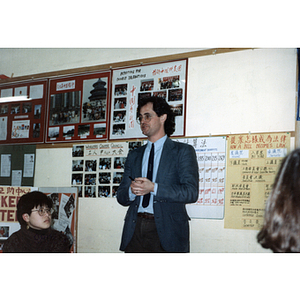 Man speaks to Chinese Progressive Association members