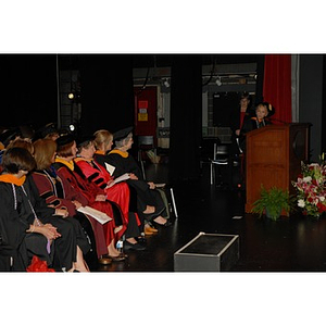 Students and faculty members from the School of Nursing seated on the stage during convocation