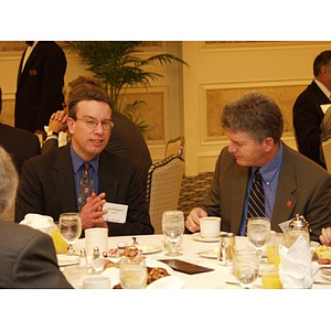 Two men at table during the College of Business Administration's CEO Breakfast Forum