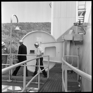 Yankee Atomic: men walking on the deck outside the containment building